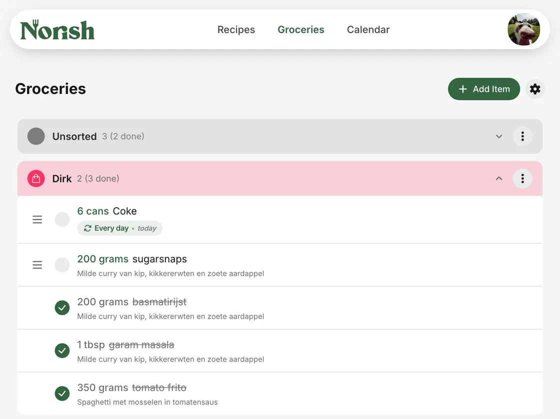 A shared Norish grocery list grouped by shop, with one group folded away and items ticked off
